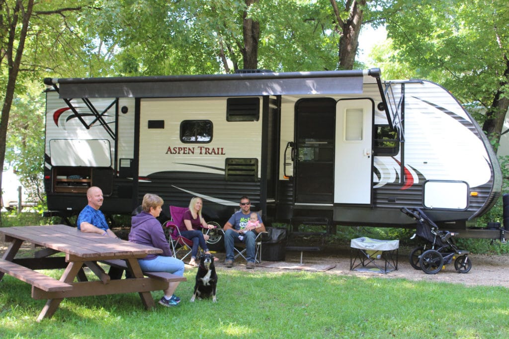 Campers with their Camping Equipment
